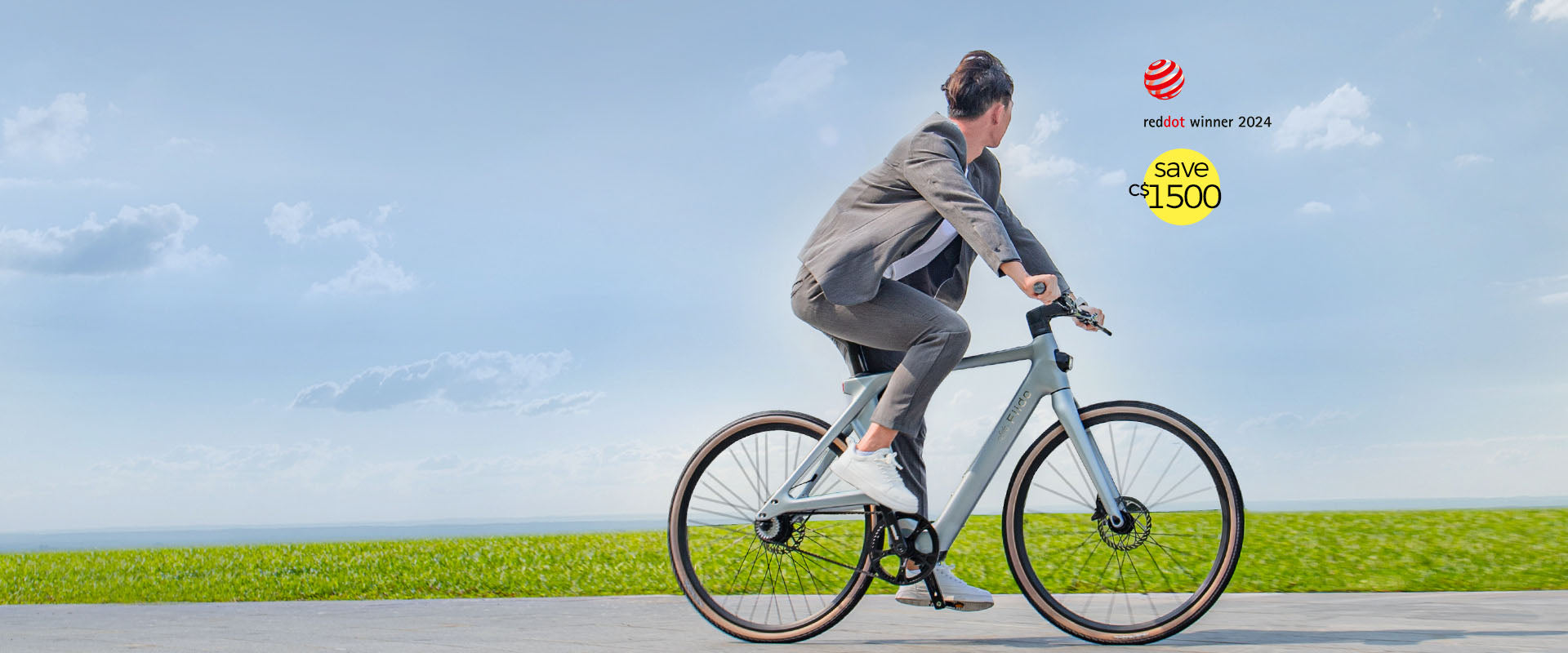 A man in gray clothing rides a Fiido Air electric bike on a highway - pc